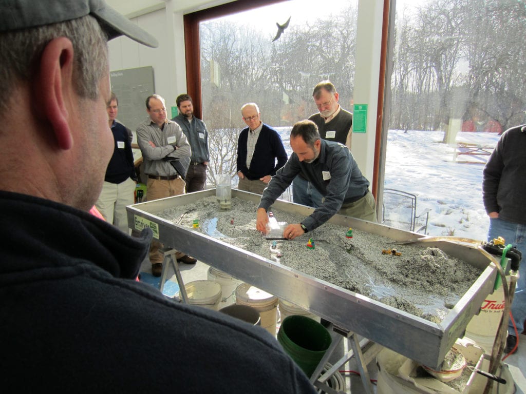 Alex Abbott demonstrates how Stream Smart culverts work during a workshop at Gilsland Farm