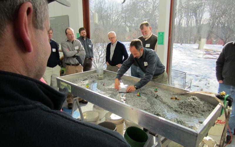 Alex Abbott demonstrates how Stream Smart culverts work during a workshop at Gilsland Farm
