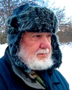 Jay Stormer in an Aviator winter hat on a bird walk starting at -5 deg. F.