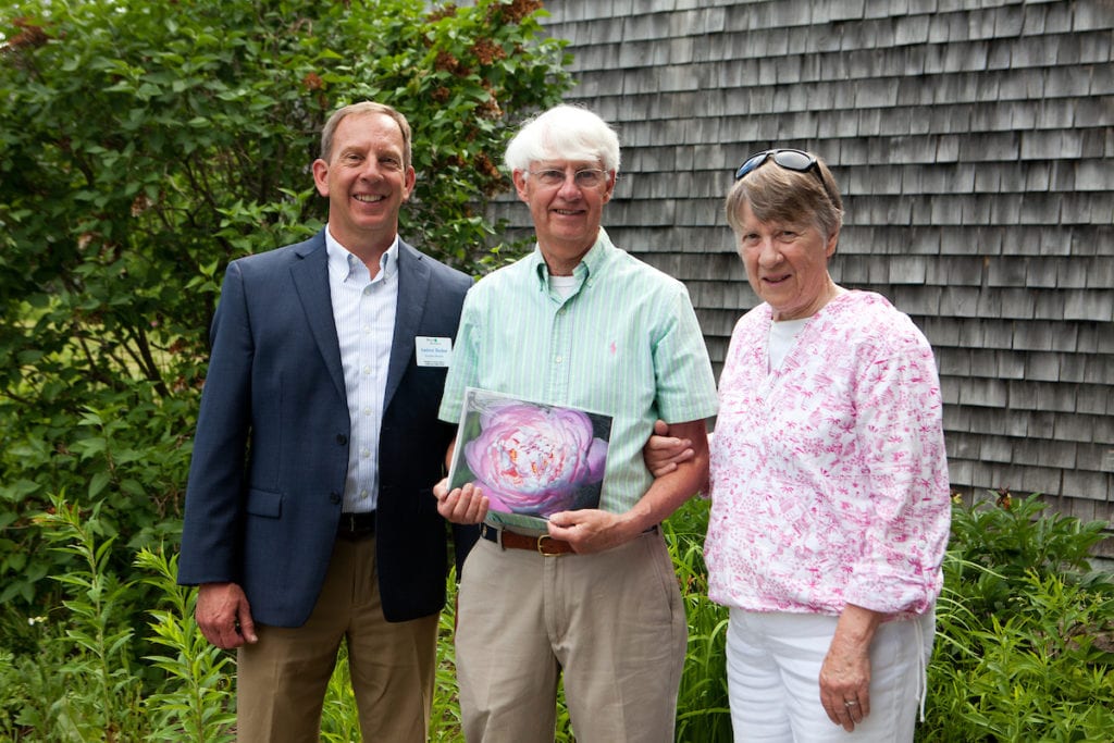 Andy Beahm presents a gift to Peony Circle of Friends members at Peony Day 2018
