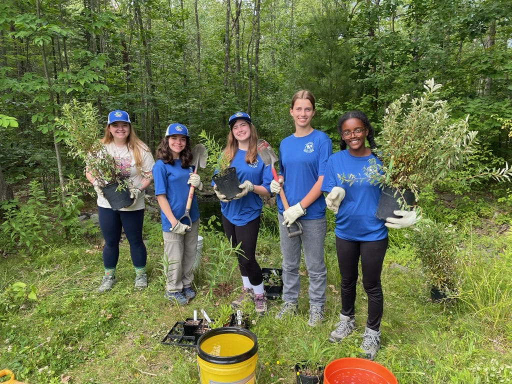 Portland Youth Corps planting native plants June 2022