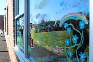 Yarmouth Elementary School windows decorated by students to prevent bird strikes