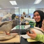 Students at Moore Middle School in Portland studying birds